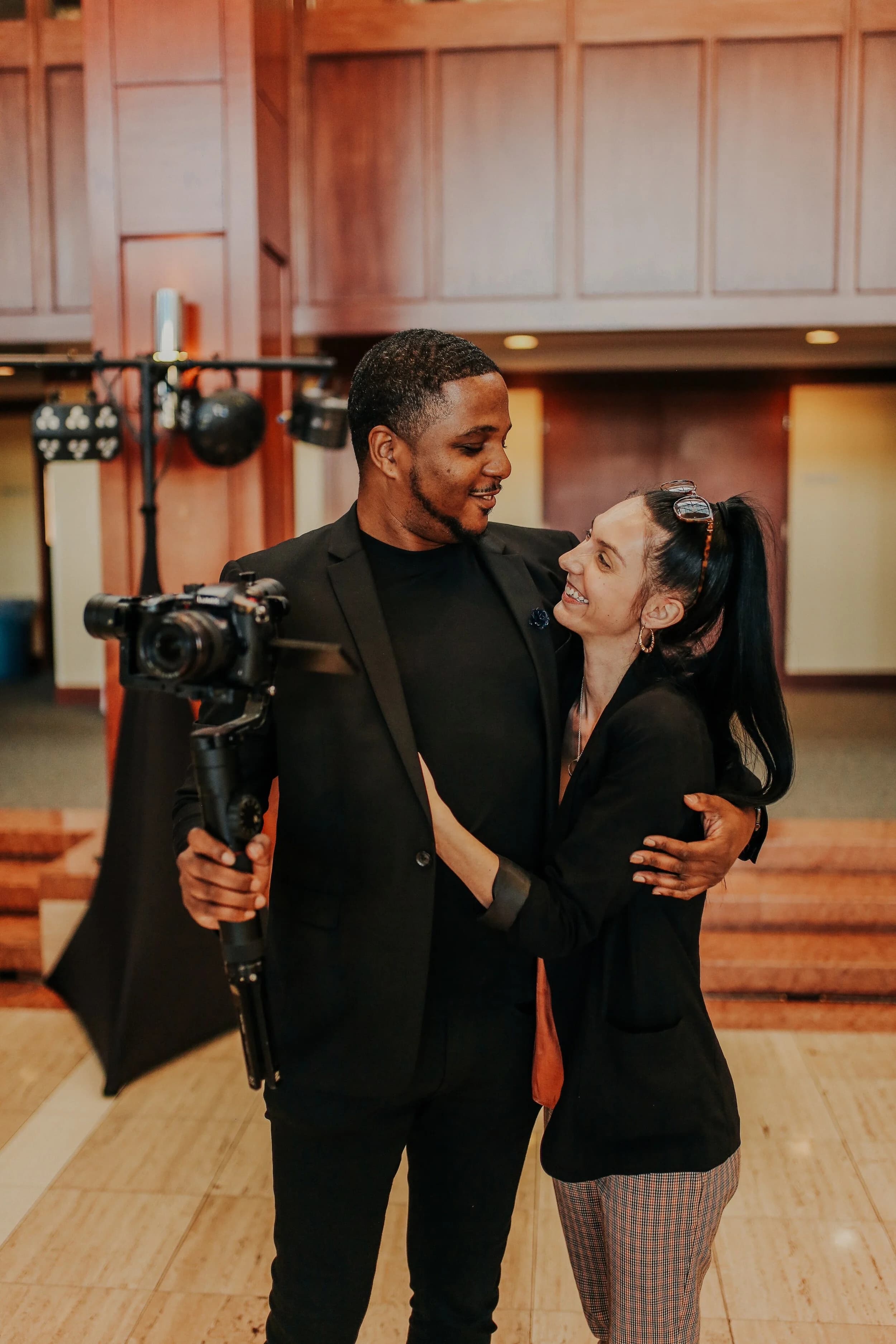 Behind the scenes at a wedding — the two of us, camera rig in hand