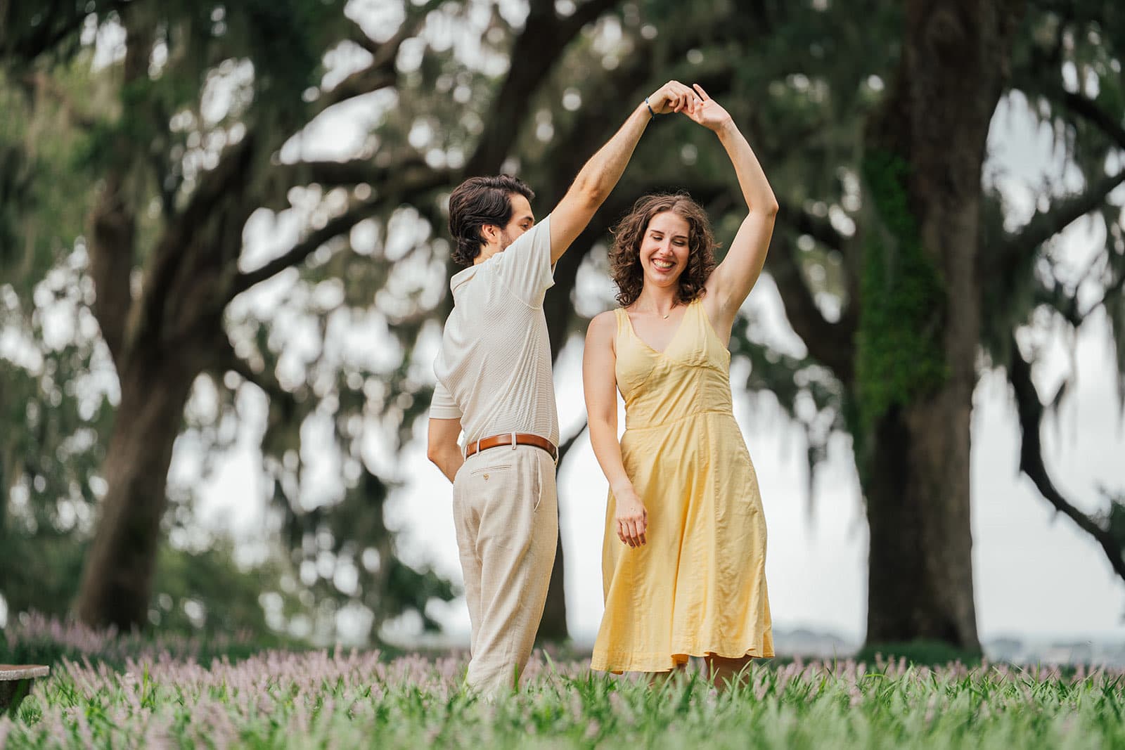 Couple dancing under mossy oaks